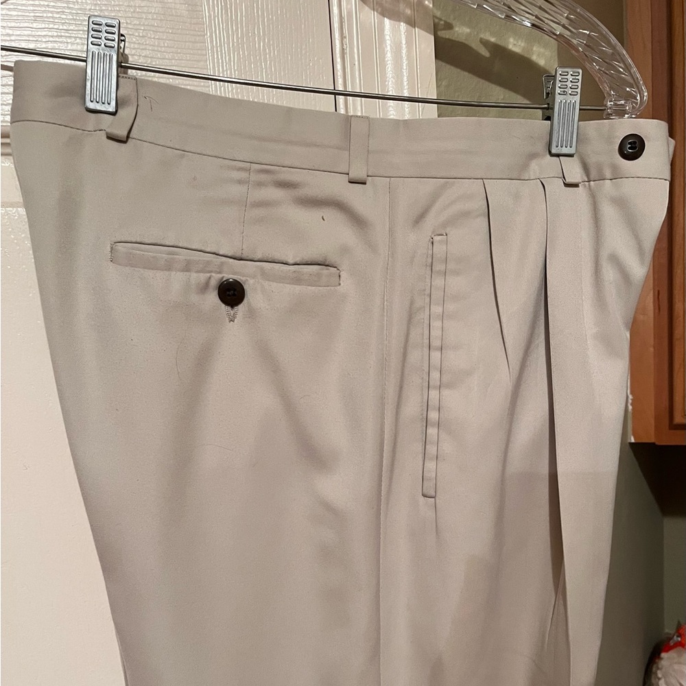 Haggar men’s double pleated, cuffed, no iron khaki slacks. Size 32 / 30. Used.
